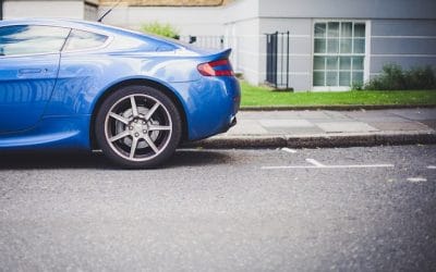 blue car blocking driveway